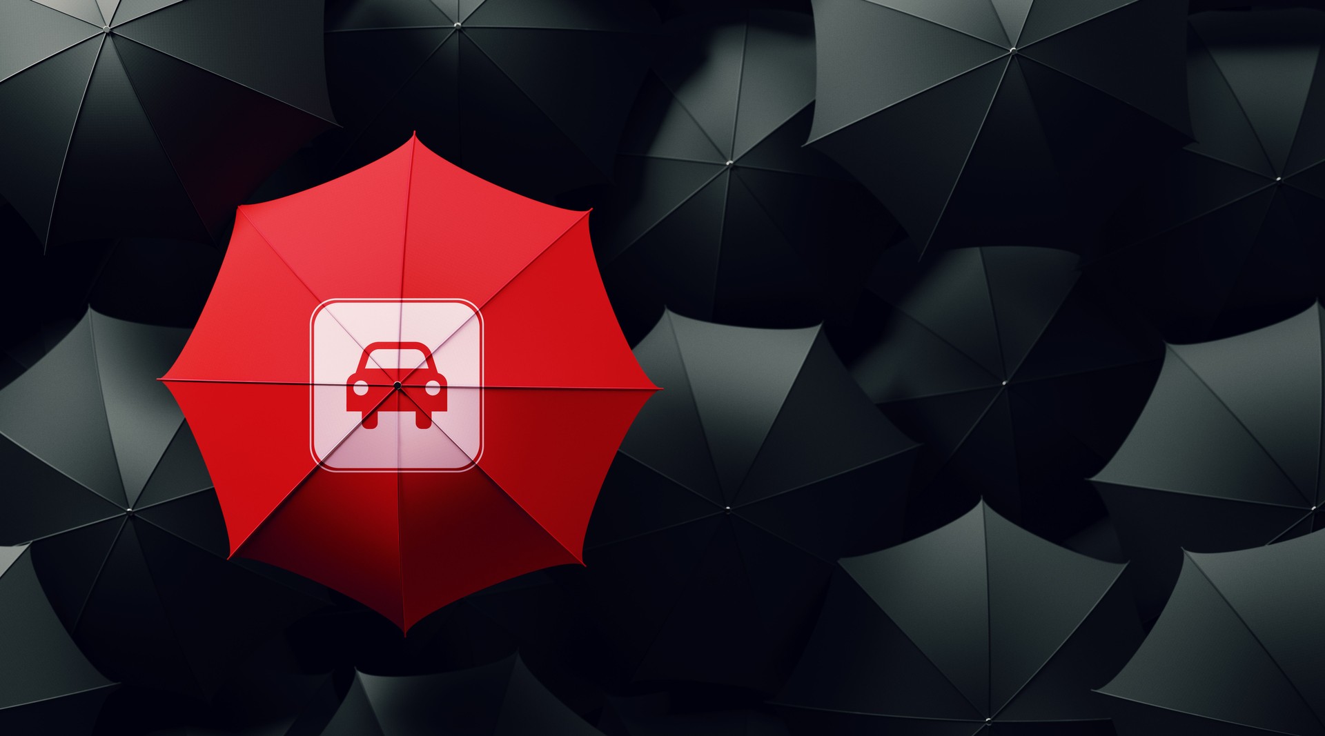 Red Umbrella Surrounded By Black Umbrellas - Car Insurance Concept