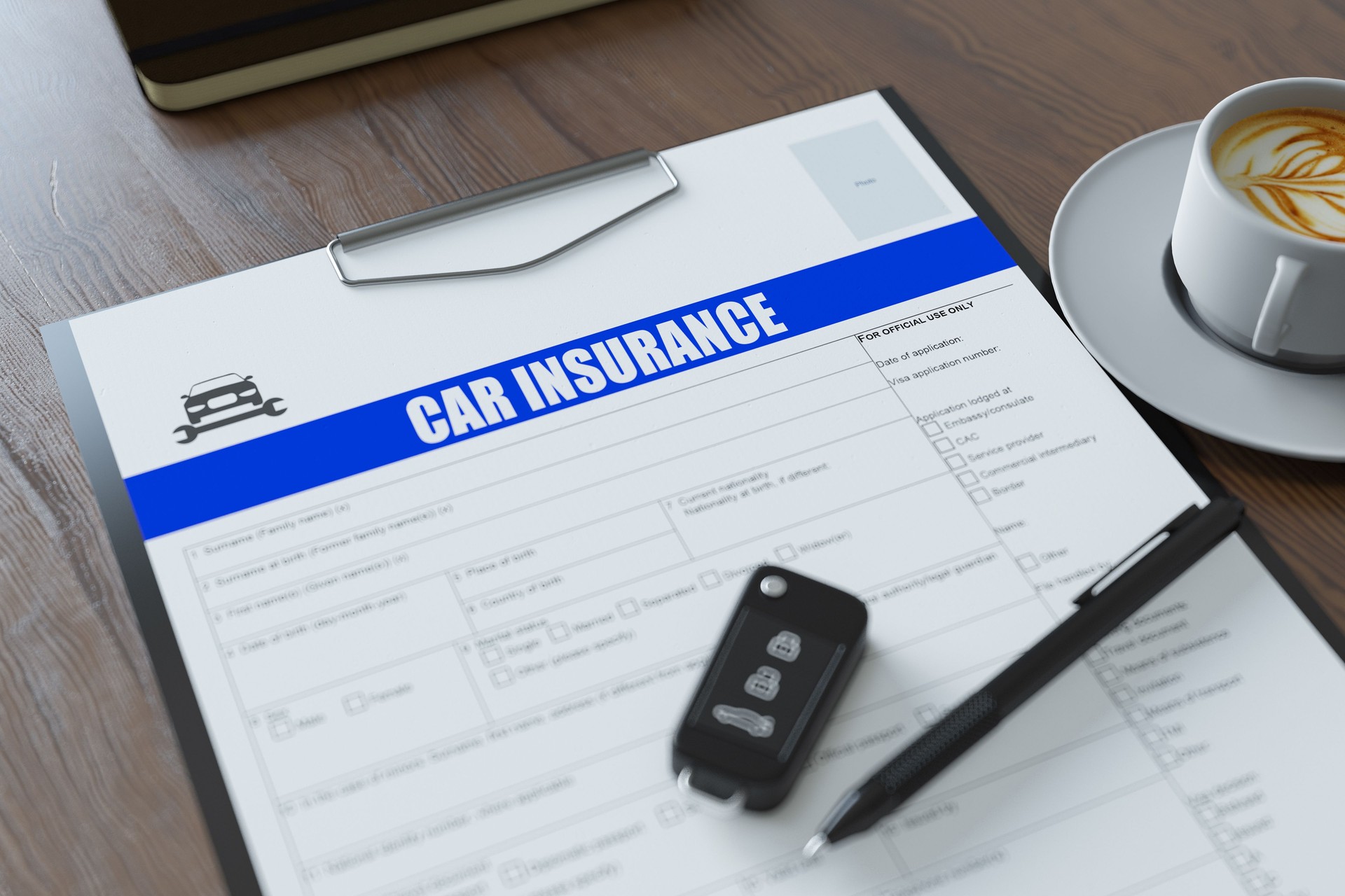 Car Insurance Form with Car Key Pen and Coffee